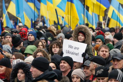 A boy holds a poster during a memorial rally to commemorate people who were killed during the uprising on Maidan square a year ago, in Kiev February 22, 2015.  REUTERS/Valentyn Ogirenko  (UKRAINE - Tags: ANNIVERSARY CIVIL UNREST) - GM1EB2M1P2901