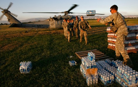 Image result for U.S. soldiers of the 82nd Airborne help load water onto a Navy helicopter at a staging area at Port-au-Prince international airport January 17, 2010. Relief efforts continue in the island nation's capital after last week's devastating earthquake. U.S. troops will help U.N. peacekeepers keep order on Haiti's increasingly lawless streets, the country's president said on Sunday as aid workers struggled to get food and medical assistance to desperate earthquake survivors.      REUTERS/Hans Deryk    (HAITI - Tags: DISASTER MILITARY) - GM1E61I0YZK01