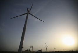 Power generating windmill turbines are pictured during the inauguration ceremony of the new 25 MW ReNew Power wind farm at Kalasar village in the western Indian state of Gujarat May 6, 2012. REUTERS/Amit Dave (INDIA - Tags: ENERGY BUSINESS) - GM1E85700TW02