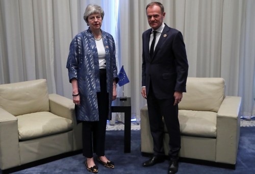 Britain's Prime Minister Theresa May poses with European Council President Donald Tusk during a summit between Arab League and European Union member states, in the Red Sea resort of Sharm el-Sheikh, Egypt, February 24, 2019.  Francisco Seco/Pool via REUTERS - RC189D37BCC0