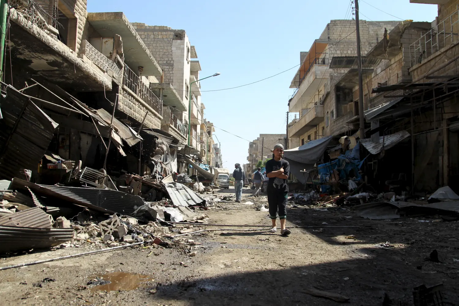 A man walks near damaged shops after an airstrike on a market in the town of Maarat al-Numan in the insurgent stronghold of Idlib province, Syria April 19, 2016. REUTERS/Ammar Abdullah      TPX IMAGES OF THE DAY      - GF10000388237