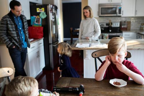Nobel Lett (R), who suffers from Prader-Willi Syndrome and is treated under the Children's Health Insurance Program (CHIP), eats a snack with his family after school in his home in Columbus, Ohio, U.S. January 17, 2018.   REUTERS/Maddie McGarvey - RC14BB847C60