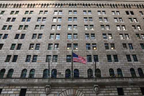 The U.S. flag flies on the Federal Reserve Bank of New York in the financial district in New York City, U.S., March 4, 2019. REUTERS/Brendan McDermid - RC147A03C280