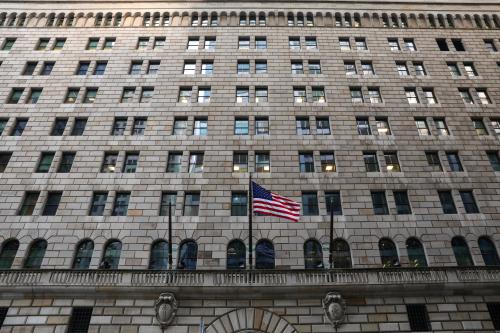 The U.S. flag flies on the Federal Reserve Bank of New York in the financial district in New York City, U.S., March 4, 2019. REUTERS/Brendan McDermid - RC147A03C280