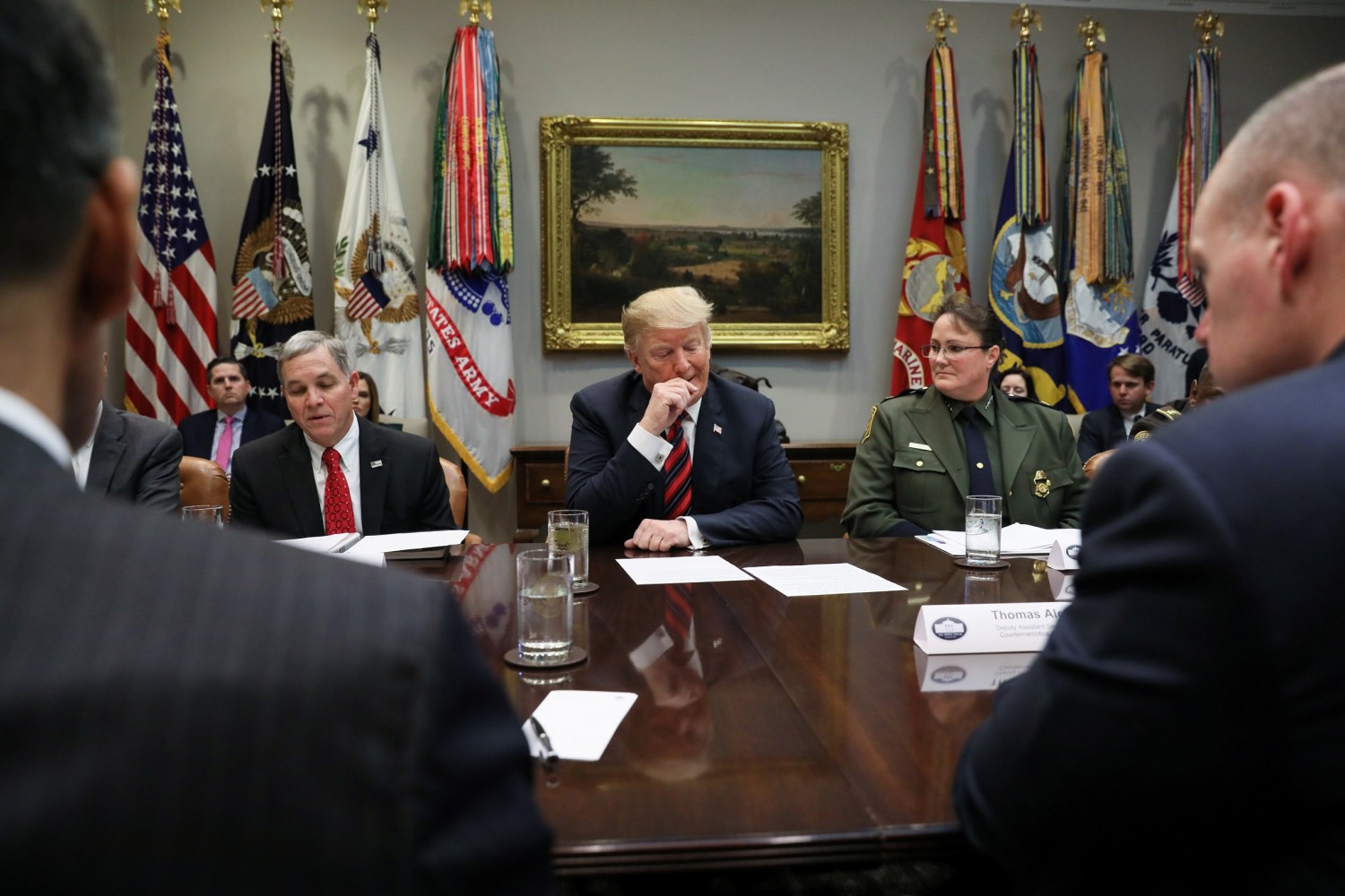 U.S. President Donald Trump, flanked by Houston High Intensity Drug Trafficking Area (HIDTA) Director Mike McDaniel and Chief of U.S. Border Patrol Carla Provost, holds a briefing on "drug trafficking on the southern border" in the Roosevelt Room at the White House in Washington, U.S. March 13, 2019.  REUTERS/Jonathan Ernst - RC1453617A40