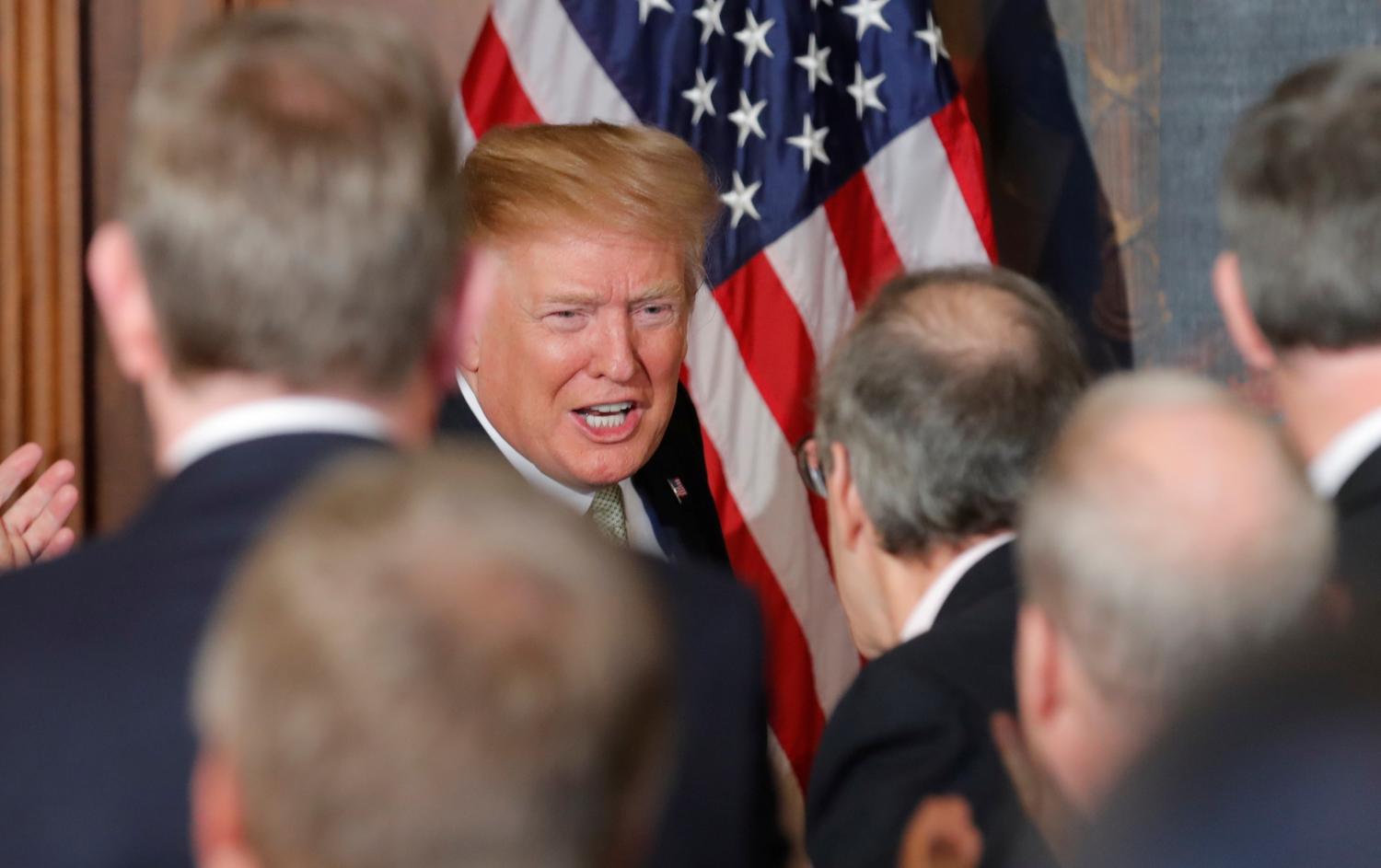 U.S. President Donald Trump shakes hands with members of Congress as he arrives at the 37th annual Friends of Ireland luncheon at the U.S. Capitol in Washington, U.S., March 14, 2019. REUTERS/Jim Young - RC1C5F28A710