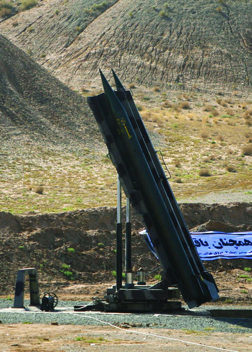 EDITORS' NOTE: Reuters and other foreign media are subject to Iranian restrictions on their ability to film or take pictures in Tehran.An Iranian Zelzal missile is ready for launch during a test at an unknown location in central Iran September 27, 2009. Iran test-fired short-range missiles on Sunday to show it was prepared to head off any military threat, four days before the Islamic Republic is due to hold rare talks with world powers worried about its nuclear ambitions. REUTERS/Fars News/Ali Shayegan (IRAN MILITARY POLITICS) QUALITY FROM SOURCE - GM1E59R1K5U01