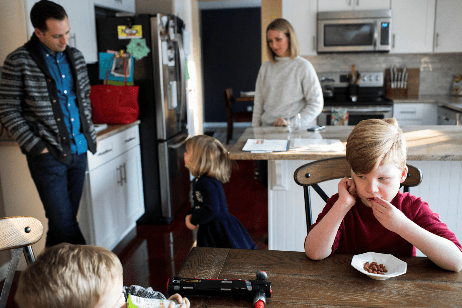 Nobel Lett (R), who suffers from Prader-Willi Syndrome and is treated under the Children's Health Insurance Program (CHIP), eats a snack with his family after school in his home in Columbus, Ohio, U.S. January 17, 2018. REUTERS/Maddie McGarvey