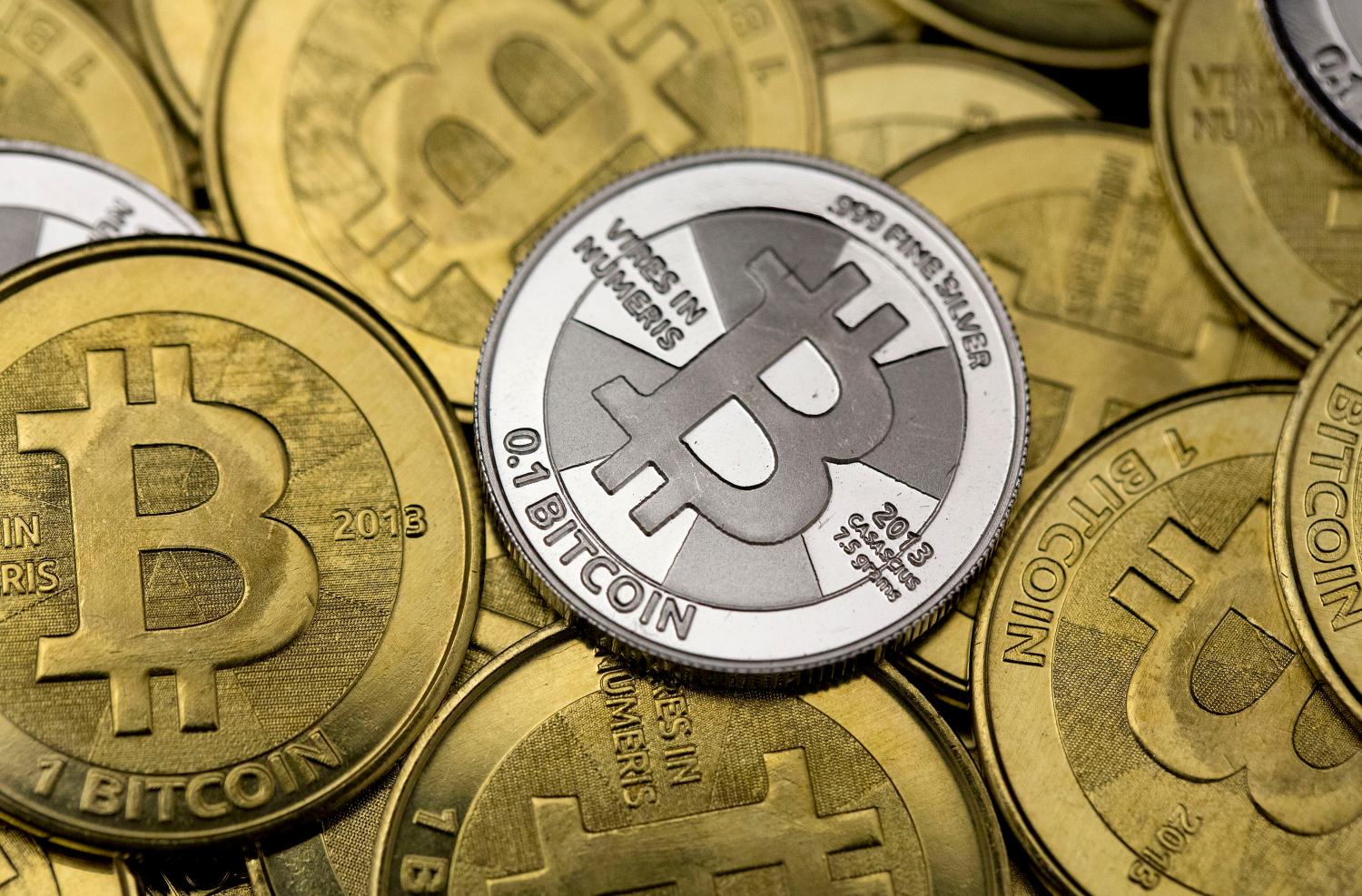 Some of Bitcoin enthusiast Mike Caldwell's coins are pictured at his office in this photo illustration in Sandy, Utah, January 31, 2014. REUTERS/Jim Urquhart  REUTERS/Jim Urquhart   (UNITED STATES - Tags: BUSINESS) - GM1EA210CYA01