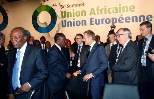 Ivory Coast's President Alassane Ouattara talks with Eropean Council President Donald Tusk during the closing session of the 5th African Union - European Union (AU-EU) summit in Abidjan, Ivory Coast November 30, 2017. REUTERS/Luc Gnago - RC1B6F41CF00