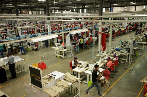 Workers sew clothes inside the Indochine Apparel PLC textile factory in Hawassa Industrial Park in Southern Nations, Nationalities and Peoples region, Ethiopia November 17, 2017. Picture taken November 17, 2017.REUTERS/Tiksa Negeri - RC15A6463860