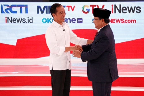 Indonesia's presidential candidate Joko Widodo (L) shakes hands with his opponent Prabowo Subianto after the second debate between presidential candidates ahead of the next general election in Jakarta, Indonesia, February 17, 2019. REUTERS/Willy Kurniawan - RC1B58C98B50