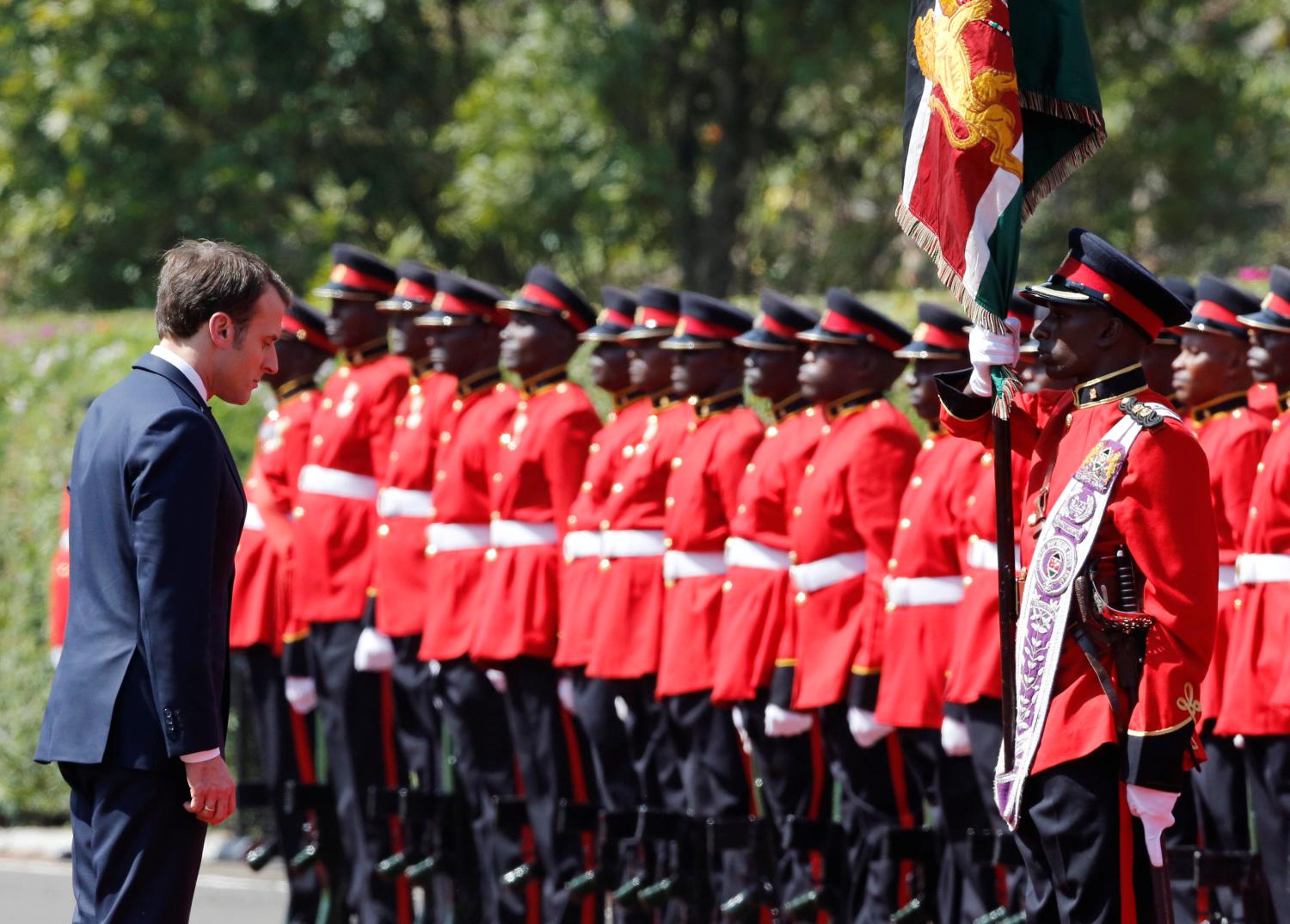 French President Emmanuel Macron inspects a guard of honour by the Kenya Defence Forces at State House in Nairobi, Kenya March 13, 2019. REUTERS/Thomas Mukoya - RC135F2FDDE0