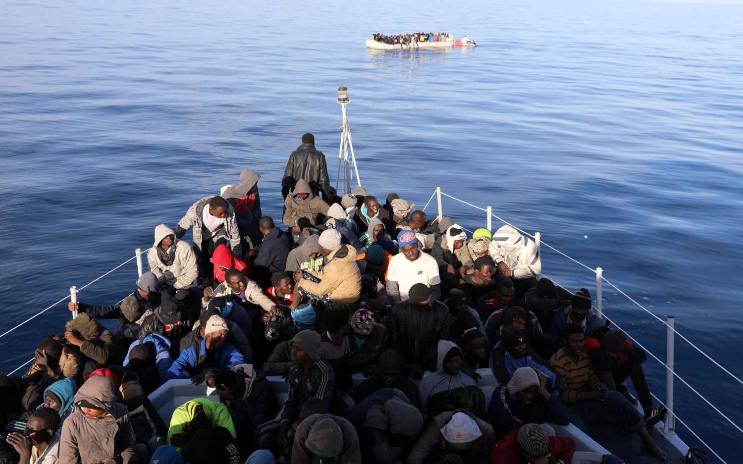 Migrants are seen as they are rescued by Libyan coast guards in the Mediterranean Sea off the coast of Libya, January 15, 2018. Picture taken January 15, 2018. REUTERS/Hani Amara - RC18027683D0