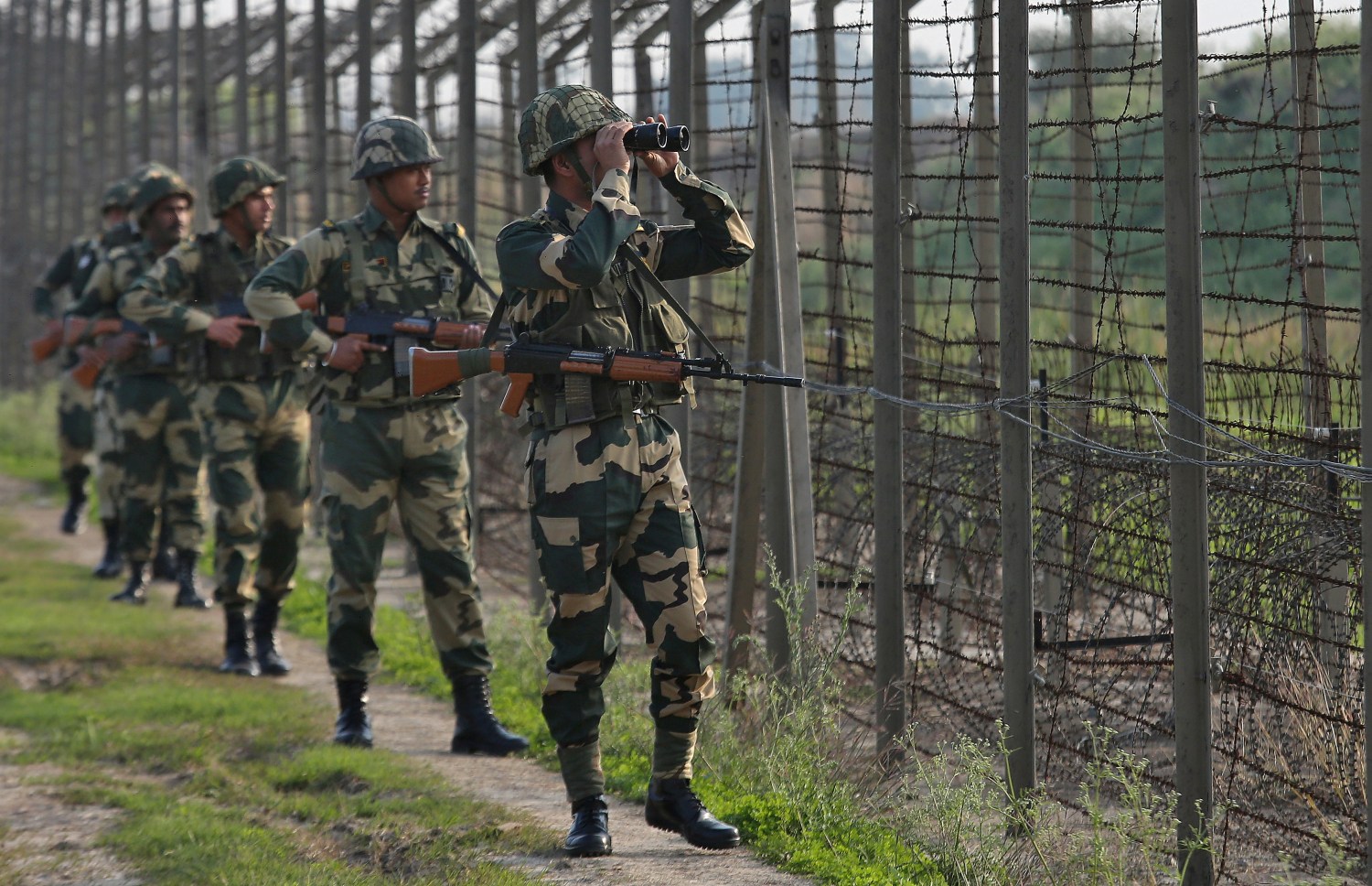 India's Border Security Force (BSF) soldiers patrol along the fenced border with Pakistan in Ranbir Singh Pura sector near Jammu February 26, 2019. REUTERS/Mukesh Gupta - RC1F4D99BF00