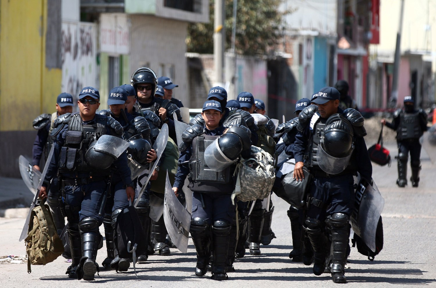 DATE IMPORTED: March 06, 2019 Police officers patrol a street after a blockade set by members of the Santa Rosa de Lima Cartel to repel security forces during an anti-fuel theft operation in Santa Rosa de Lima, in Guanajuato state, Mexico, March 6, 2019. REUTERS/Edgard Garrido