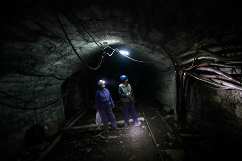 Sakiba Covic (L) and Semsa Hadzo walk through a coal mine in Breza, March 5, 2013. Covic and Hadzo are the only female coal miners in all of Bosnia and Herzegovina. Their job requires them to take daily measurements of air, gas and to supervise the general safety of the mine, according to local media. Picture taken March 5, 2013. REUTERS/Dado Ruvic (BOSNIA AND HERZEGOVINA - Tags: BUSINESS ENERGY SOCIETY EMPLOYMENT) - GM1E9371M2C01