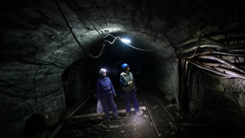 Sakiba Covic (L) and Semsa Hadzo walk through a coal mine in Breza, March 5, 2013. Covic and Hadzo are the only female coal miners in all of Bosnia and Herzegovina. Their job requires them to take daily measurements of air, gas and to supervise the general safety of the mine, according to local media. Picture taken March 5, 2013. REUTERS/Dado Ruvic (BOSNIA AND HERZEGOVINA - Tags: BUSINESS ENERGY SOCIETY EMPLOYMENT) - GM1E9371M2C01