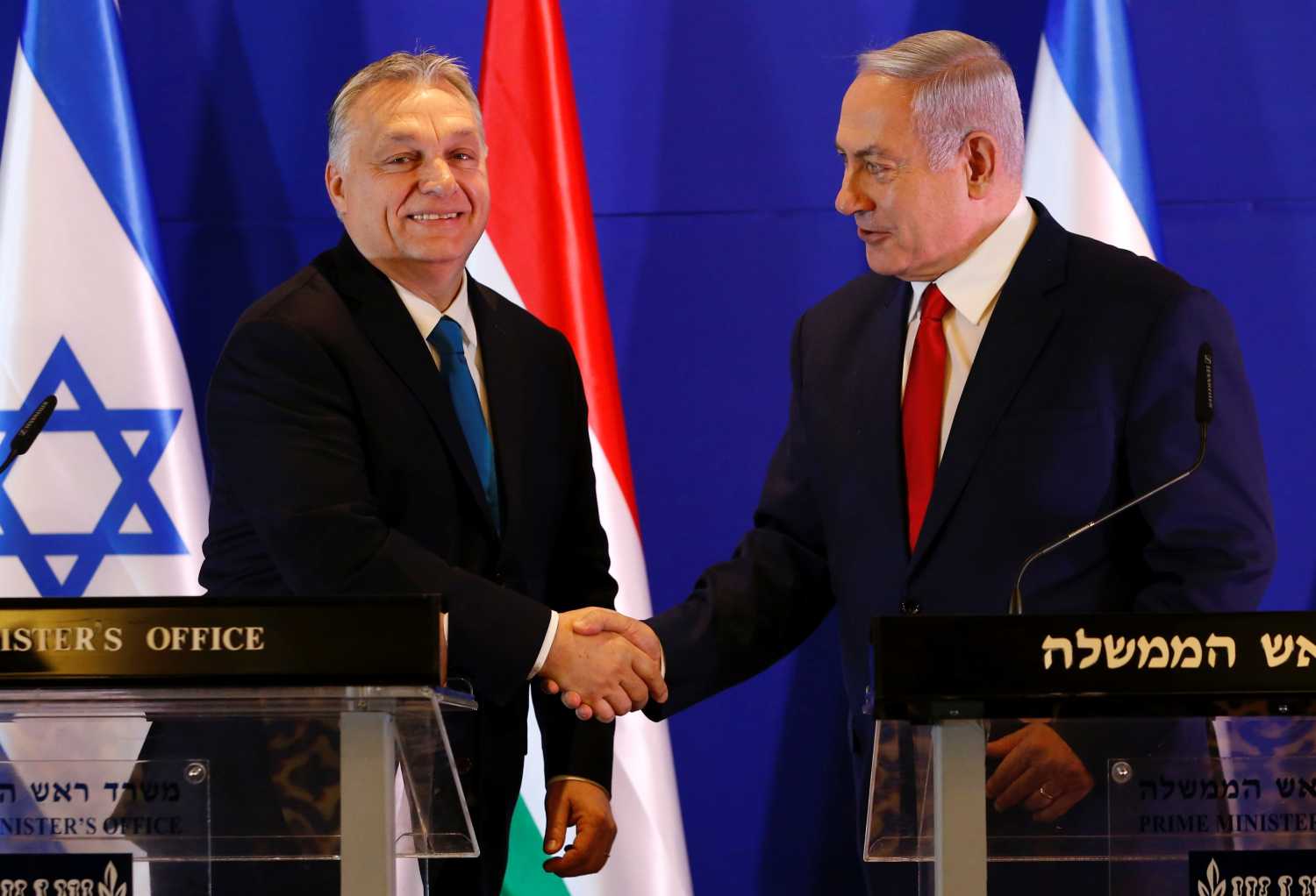 Hungarian Prime Minister Viktor Orban and Israeli Prime Minister Benjamin Netanyahu shake hands after their meeting in Jerusalem February 19, 2019. Ariel Schalit /Pool via REUTERS  *** Local Caption *** - RC16E22BC130