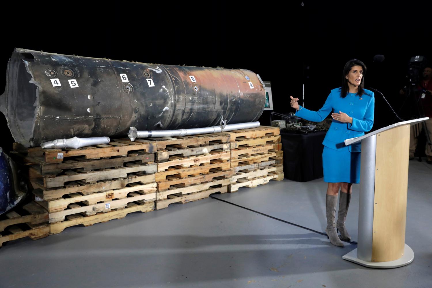 U.S. Ambassador to the United Nations Nikki Haley briefs the media in front of remains of Iranian "Qiam" ballistic missile provided by Pentagon at Joint Base Anacostia-Bolling in Washington, U.S., December 14, 2017. REUTERS/Yuri Gripas - RC1784CD2850