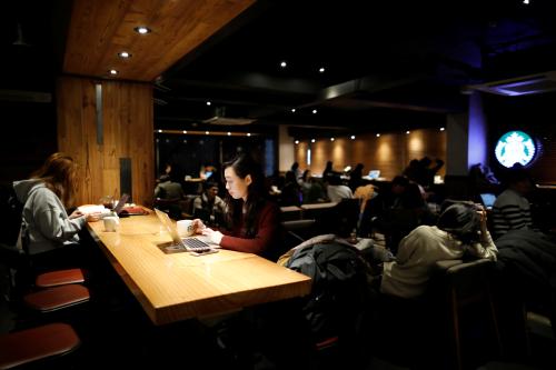 Park Hye-ri, 28, a startup business program manager, who spent time at Prison Inside Me, a mock prison facility, uses a laptop at a cafe in Incheon, South Korea, November 13, 2018. REUTERS/Kim Hong-Ji      SEARCH "PRISON RETREAT" FOR THIS STORY. SEARCH "WIDER IMAGE" FOR ALL STORIES. - RC148F7054E0
