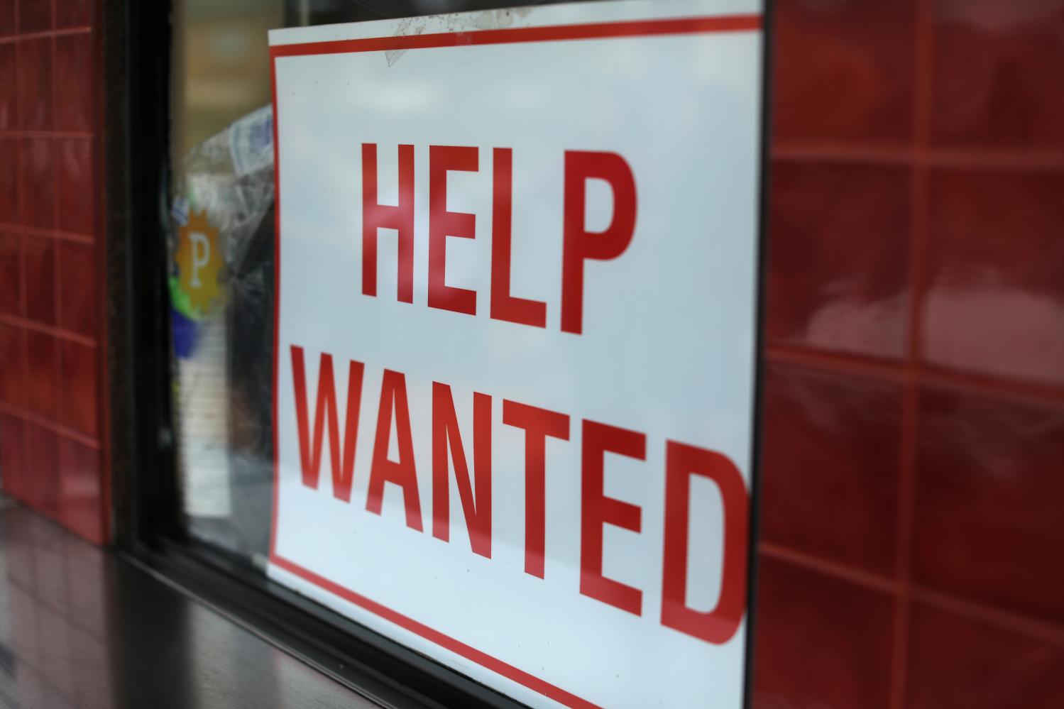 A help wanted sign is posted at a taco stand in Solana Beach, California, U.S., July 17, 2017.   REUTERS/Mike Blake - RC17CC5DC0B0