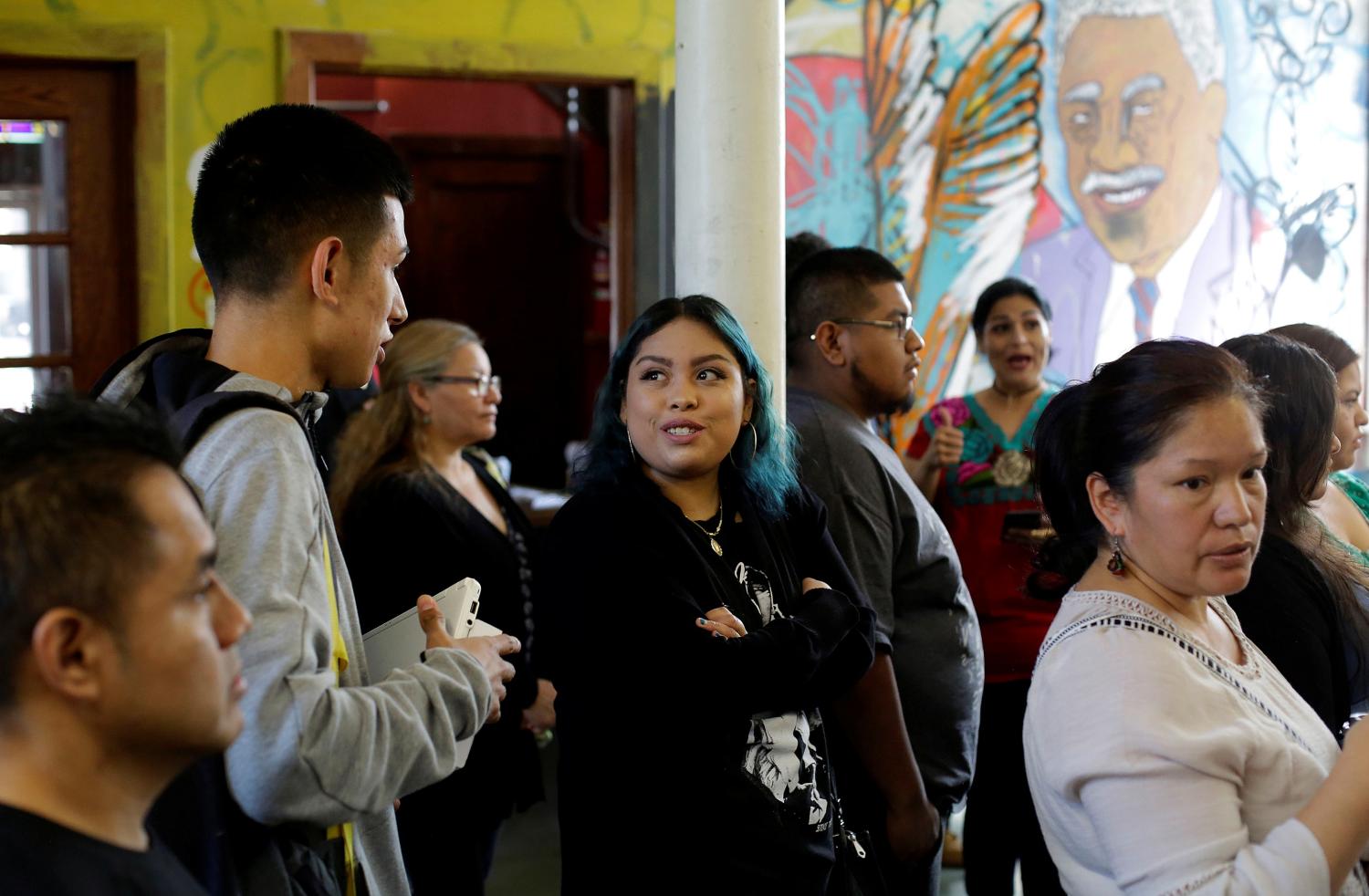 Yemeni Guerrero (C), a Deferred Action for Childhood Arrivals (DACA) recipient, attends the immigration ministry at Lincoln Methodist Church to fill out her renewal application in Chicago, Illinois, U.S. September 10, 2017. DACA recipients gathered to fill out applications to renew their permit before the October 5 deadline for current beneficiaries. Picture taken September 10, 2017.    REUTERS/Joshua Lott - RC13D348DB40