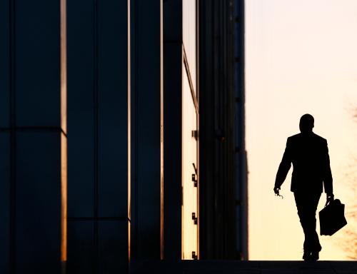 A worker arrives at his office in the Canary Wharf business district in London February 26, 2014. London's financial services sector created 25 percent more jobs in February than a year ago, new data has shown, indicating the industry may be recovering from the restructuring and redundancies prompted by the financial crisis. After a strong January, the City hiring market showed no signs of slowing down last month, with 3,220 new jobs created, compared with 2,575 added in February 2013, according to financial services recruiter Astbury Marsden. The data suggests London's banks and financial services companies are returning to growth after slashing thousands of jobs in the face of a lengthy recession and a series of industry scandals that followed the financial crisis. Picture taken February 26, 2014. REUTERS/Eddie Keogh (BRITAIN - Tags: BUSINESS EMPLOYMENT TPX IMAGES OF THE DAY)ATTENTION EDITORS: PICTURE 03 OF 25 FOR PACKAGE 'CITY OF LONDON - LIFE IN THE SQUARE MILE'. TO FIND ALL IMAGES SEARCH 'RECRUITER KEOGH' - GM1EA320PLO01