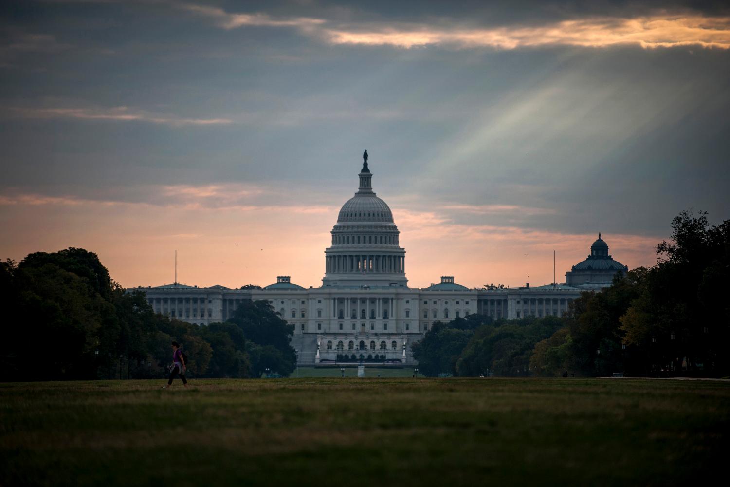 The U.S. Capitol building is seen on Tuesday morning after the federal government was shutdown when the House and Senate failed to pass a budget in Washington October 1, 2013. The lawmakers who shut down the U.S. government on Tuesday have the best view of the result from their perch in the U.S. Capitol: a two-mile stretch of museums, monuments and federal buildings along the National Mall that were closed for business. REUTERS/James Lawler Duggan   (UNITED STATES - Tags: POLITICS BUSINESS) - GM1E9A11QZF01