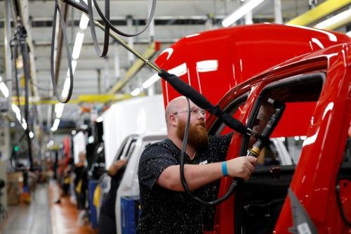 Justin Mound installs an airbag on the assembly line at GM's Chevrolet Silverado and GMC Sierra pickup truck plant in Fort Wayne, Indiana, U.S., July 25, 2018. Picture taken on July 25, 2018.  To match Insight GM-SILVERADO/ REUTERS/John Gress - RC141ABAD7C0