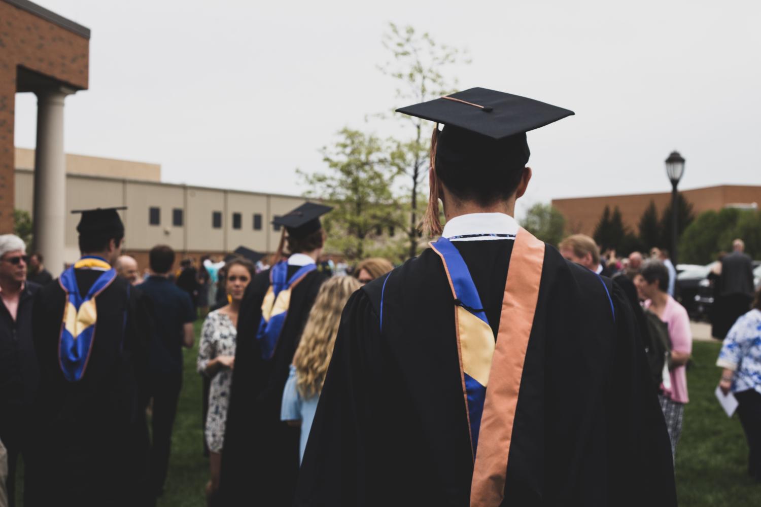 graduation, by Charles DeLoye on unsplash