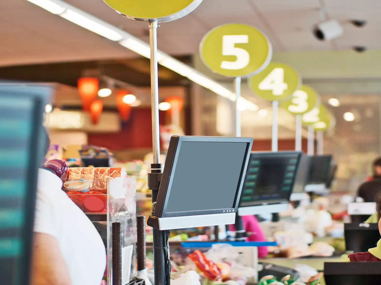 Cashier's display screen at store checkout counter. Row of screens are seen in this shallow DOF picture.