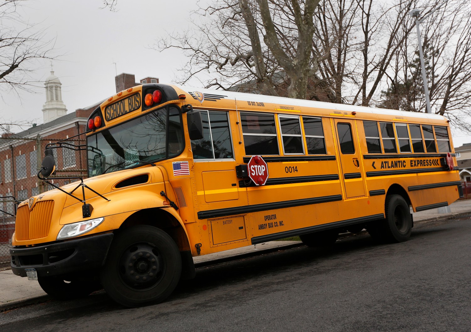 A school bus used for transporting New York City public school students is seen parked in front of a school in the Queens borough of New York January 15, 2013. New York City school bus drivers will go on strike on Wednesday, an action that Mayor Michael Bloomberg said would complicate the commute of more than 152,000 students in the nation's largest public school system. REUTERS/Shannon Stapleton (UNITED STATES - Tags: EDUCATION) - GM1E91G074101