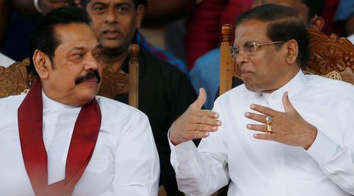 Sri Lanka's newly appointed Prime Minister Mahinda Rajapaksa and President Maithripala Sirisena talk during a rally near the parliament in Colombo, Sri Lanka November 5, 2018. REUTERS/Dinuka Liyanawatte - RC1F3E67FE20
