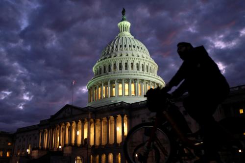 Cyclists ride past the U.S. Capitol dome in Washington, U.S., on midterm election day, November 6, 2018. REUTERS/James Lawler Duggan - RC174853F1B0