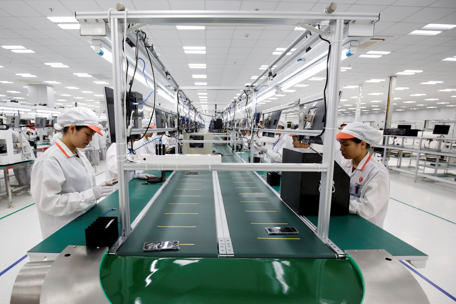 Manufacturers work at an assembly line of Vingroup's Vsmart phone in Hai Phong.