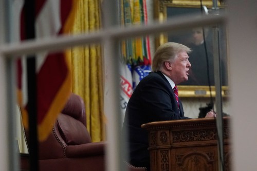 U.S. President Donald Trump delivers a televised address to the nation from his desk in the Oval Office, about immigration and the southern U.S. border on the 18th day of a partial government shutdown, at the White House in Washington, U.S., January 8, 2019. REUTERS/Joshua Roberts - RC1BC78DD490