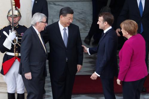 French President Emmanuel Macron, German Chancellor Angela Merkel, European Commission President Jean-Claude Juncker and Chinese President Xi Jinping prepare to enter the Elysee presidential palace in Paris, France, March 26, 2019. Thibault Camus/Pool via REUTERS - RC1D2FE021F0