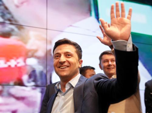 Ukrainian presidential candidate Volodymyr Zelenskiy reacts following the announcement of the first exit poll in a presidential election at his campaign headquarters in Kiev, Ukraine April 21, 2019. REUTERS/Valentyn Ogirenko - RC1D1986B430
