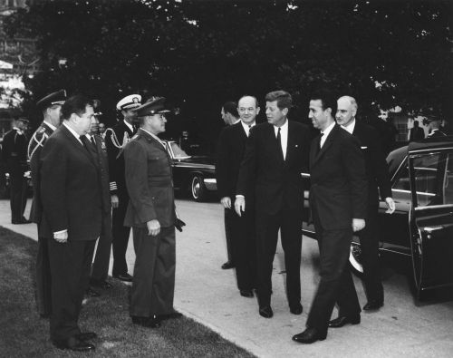 President John F. Kennedy greets Prime Minister of Algeria, Ahmed Ben Bella, upon the Prime Minister's arrival at the White House for a ceremony in his honor. 1962. Credit: JFK Library: https://www.jfklibrary.org/asset-viewer/archives/JFKWHP/1962/Month%2010/Day%2015/JFKWHP-1962-10-15-A