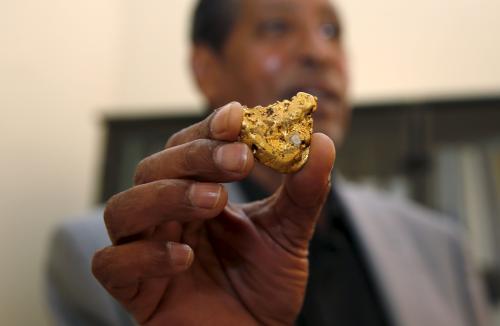 Eritrea's director-general of the Department of Mines Alem Kibreab displays a gold piece during a Reuters interview inside his office in the capital Asmara, February 16, 2016. Eritrea expects to have four mines in operation by 2018 producing gold, copper, zinc and potash as one of Africa's poorest nations looks to build an industry that can kick-start its economy, a top mining official told Reuters. To match Interview ERITREA-MINING/REUTERS/Thomas Mukoya - GF10000323043