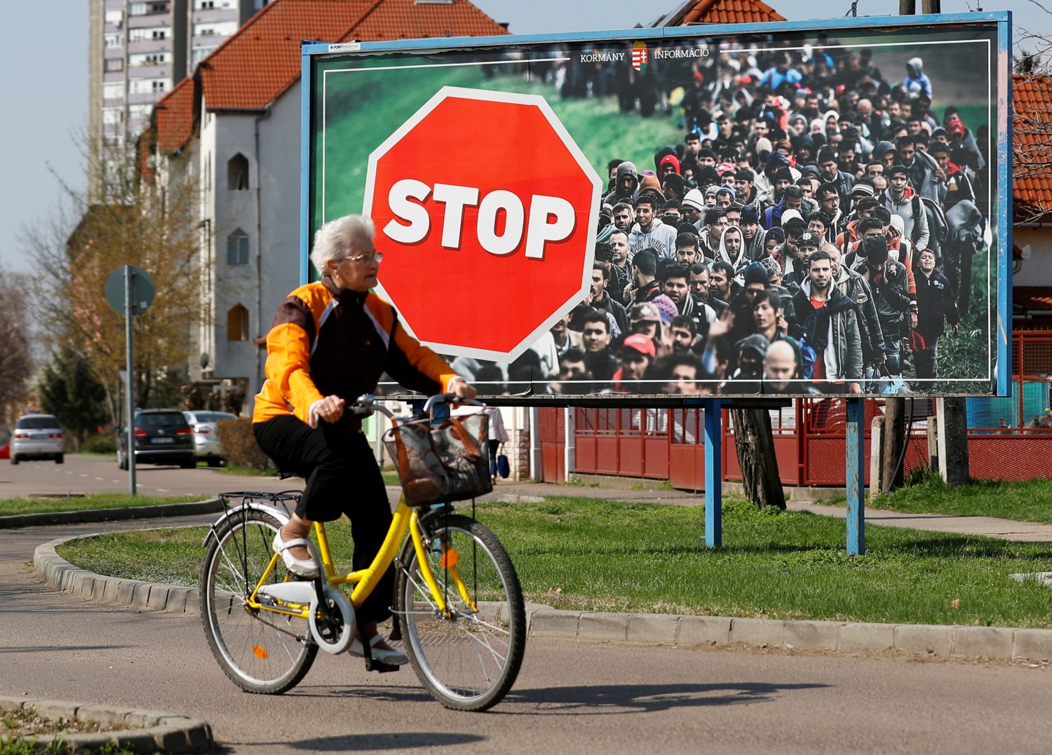 Woman passes by an election poster of Victor Orban's Fidesz party in Gyongyos, Hungary April 8, 2018. REUTERS/Leonhard Foeger - RC1B54A23090