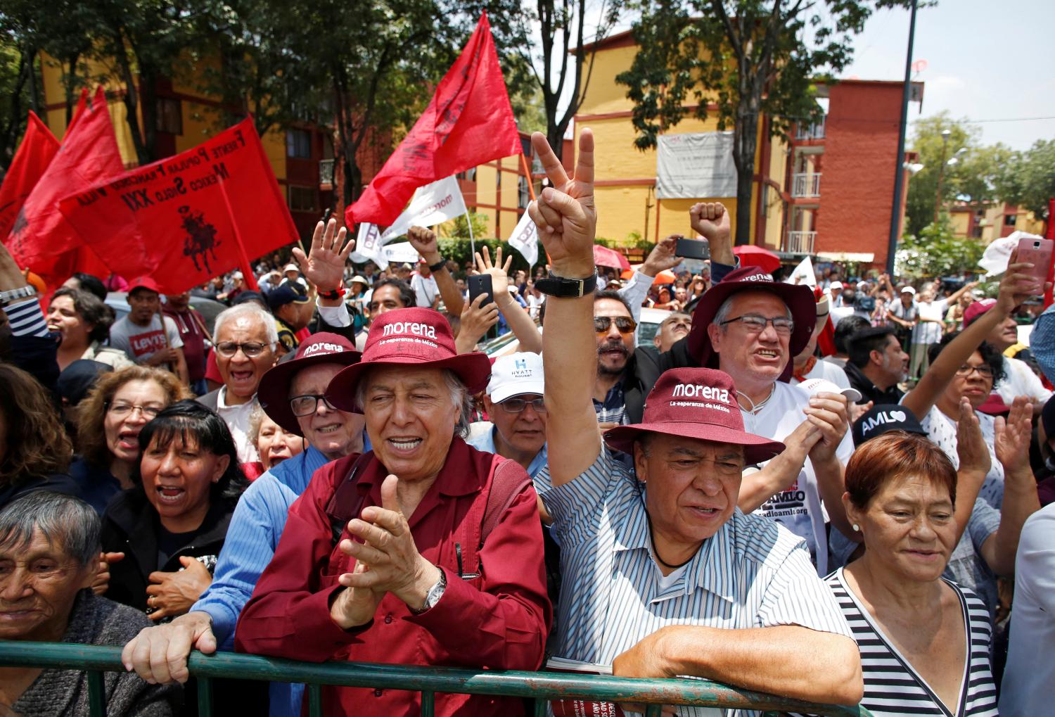 Supporters of Mexican President-elect Andres Manuel Lopez Obrador wait outside the headquarters of the electoral authority where Lopez Obrador will be formally installed as the countrys next president, in Mexico City, Mexico August 8, 2018. REUTERS/Gustavo Graf - RC11B8289710