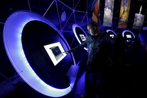 A visitor uses a touchscreen inside a dome during a European Space Expo, running under the auspices of the European Commission in Athens' Syntagma Square, March 28, 2015. REUTERS/Kostas Tsironis - GF10000041752