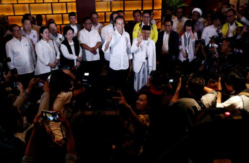 Indonesia's President Joko Widodo and his running mate Ma'ruf Amin react after a quick count result during the Indonesian elections in Jakarta, Indonesia April 17, 2019. REUTERS/Edgar Su - RC19421D72E0