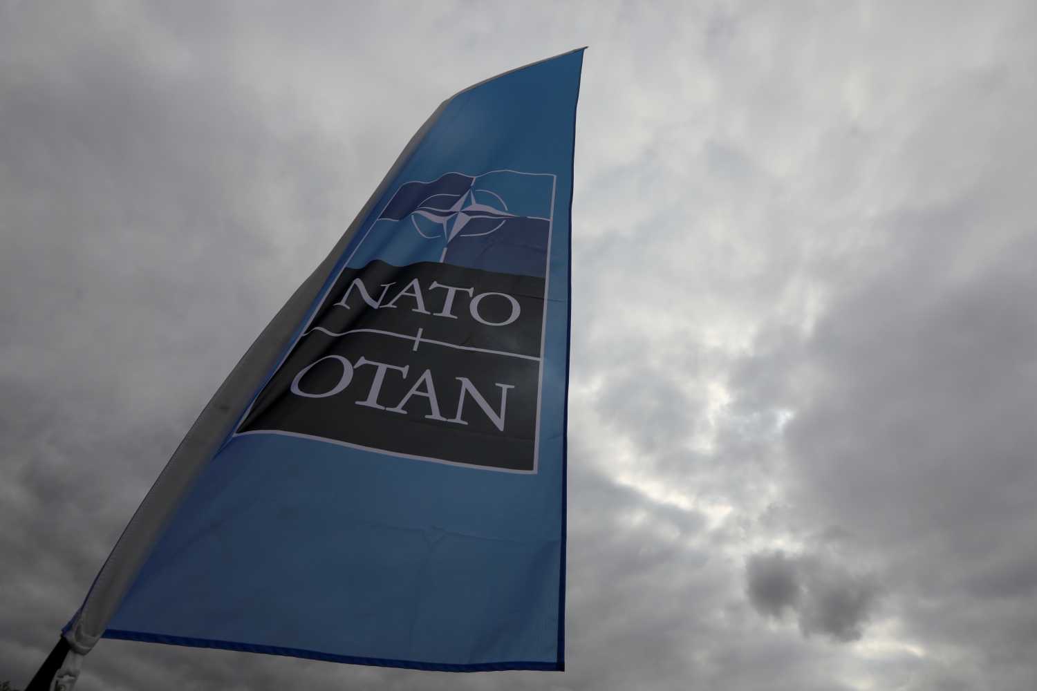 A NATO flag is seen ahead of the Summit in Brussels, Belgium, July 10, 2018. REUTERS/Reinhard Krause - RC185FE11420