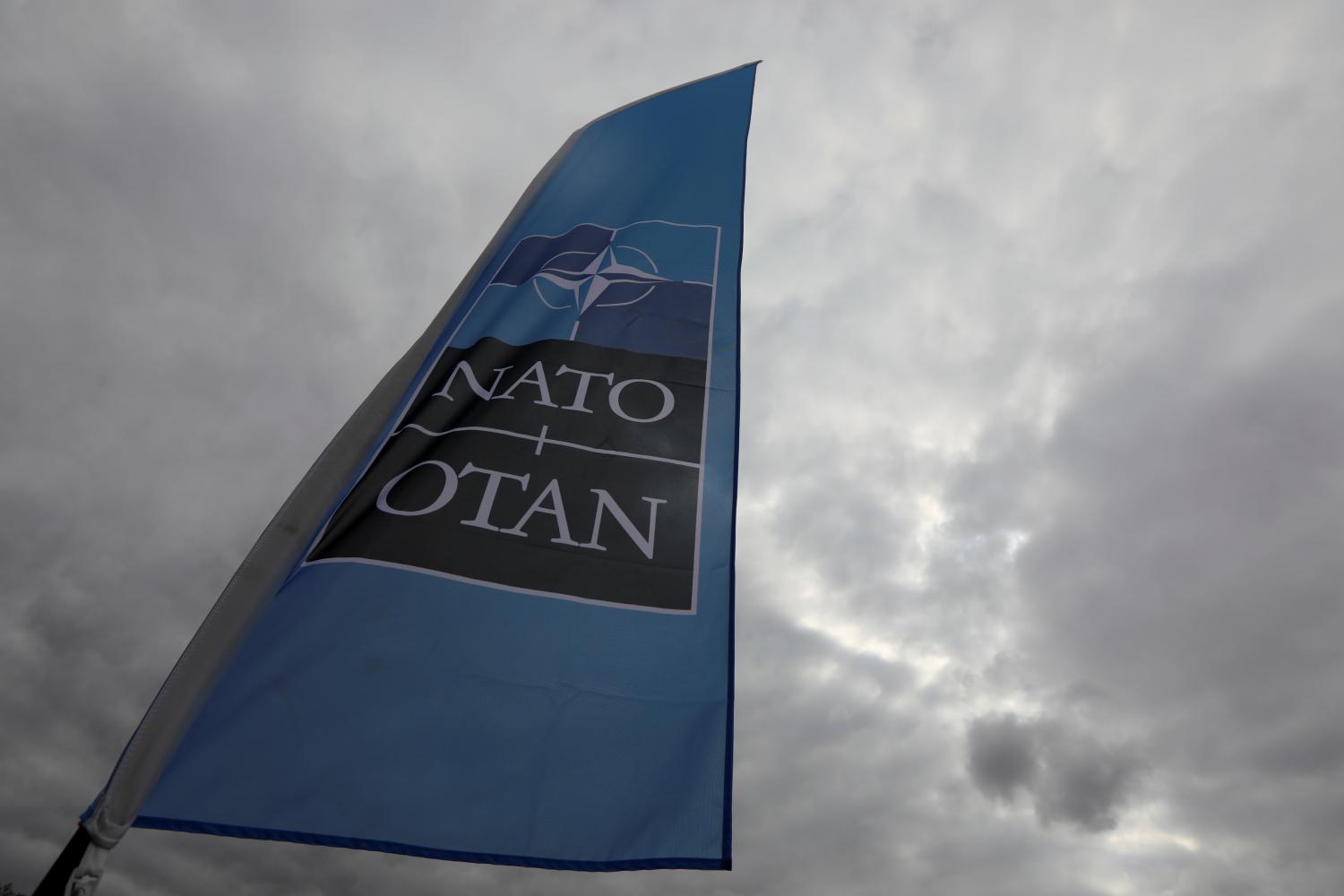 A NATO flag is seen ahead of the Summit in Brussels, Belgium, July 10, 2018. REUTERS/Reinhard Krause - RC185FE11420