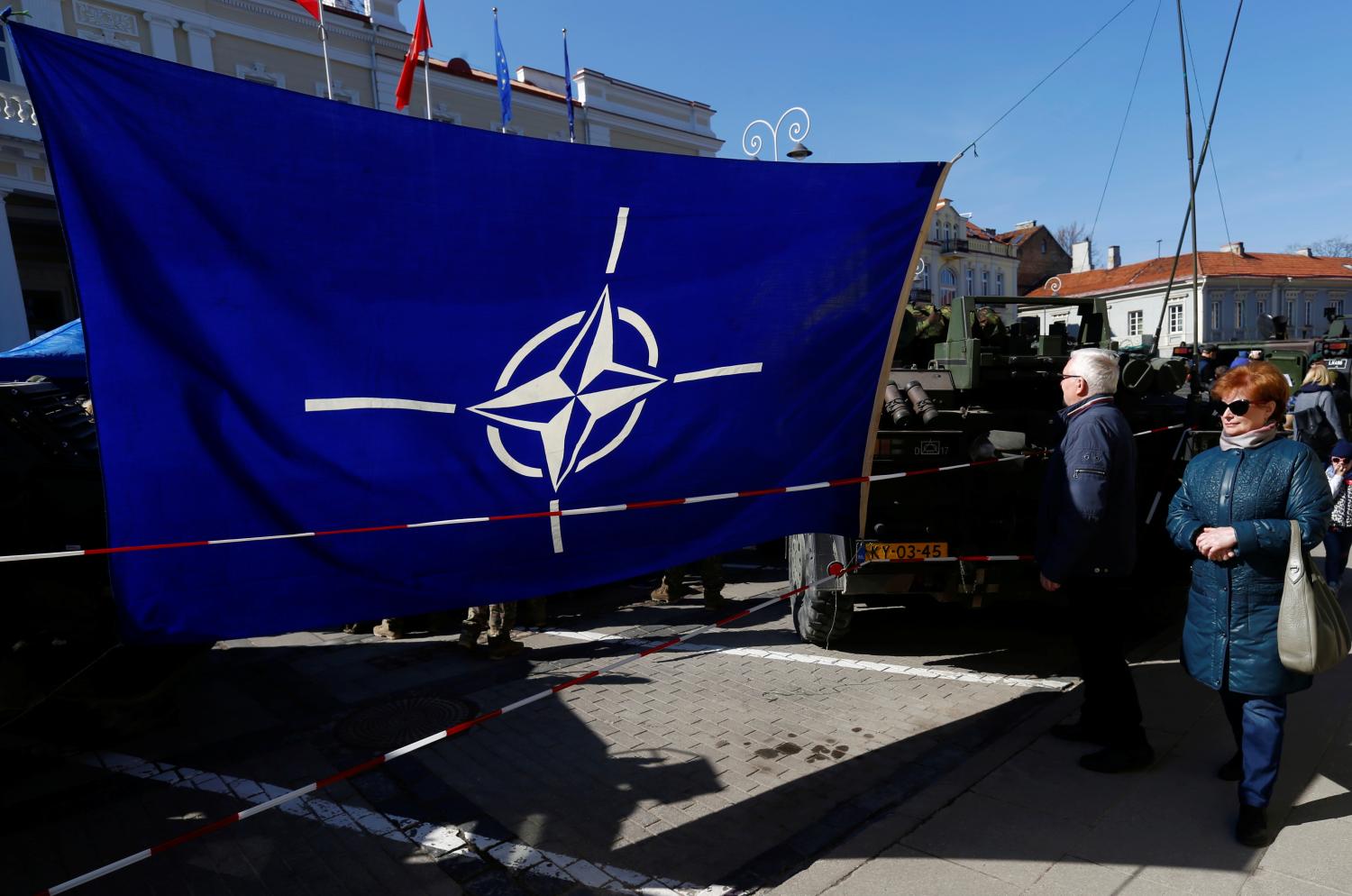 NATO flag is seen at the military equipment display during the celebration of the 15th anniversary of Lithuania's membership in NATO in Vilnius, Lithuania March 30, 2019. REUTERS/Ints Kalnins - RC1A2107E0A0