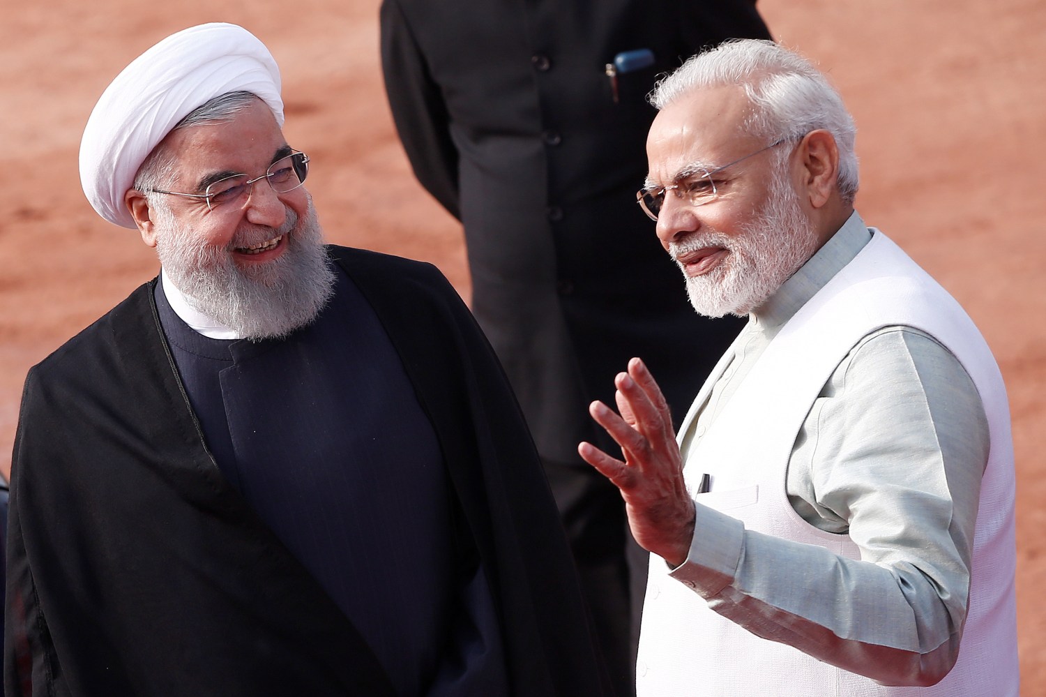 India's Prime Minister Narendra Modi (R) gestures as Iranian President Hassan Rouhani smiles during Rouhani's ceremonial reception in New Delhi, India, February 17, 2018. REUTERS/Adnan Abidi - RC13B40C5DB0