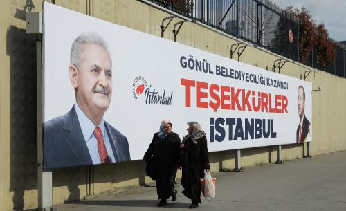 DATE IMPORTED: April 01, 2019 People walk past by AK Party billboards with pictures of Turkish President Tayyip Erdogan and mayoral candidate Binali Yildirim in Istanbul, Turkey, April 1, 2019. The billboards read: " Thank you Istanbul ". REUTERS/Huseyin Aldemir